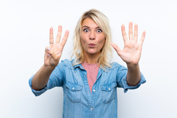 Fototapeta na wymiar Young blonde woman over isolated white background counting eight with fingers