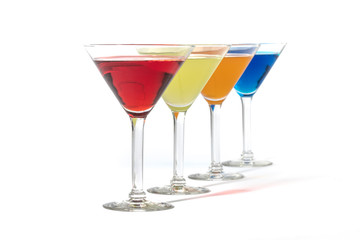 martini glasses with colorful cocktails isolated on white