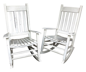 Two nostalgic well-used white rocking chairs isolated on a white background.