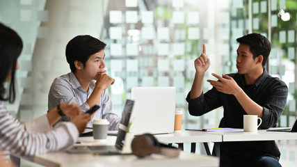 Young businessman meeting in modern office.