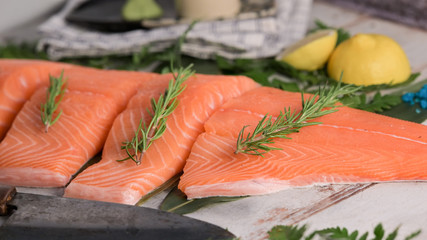 Salmon fillet with raw on wooden plate.