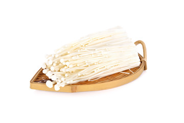 Fresh Enoki mushrooms on bamboo plate with white background