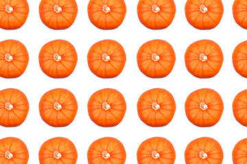 Pattern of top view of ripe orange pumpkins isolated on white background. Thanksgiving and Heloween concept.