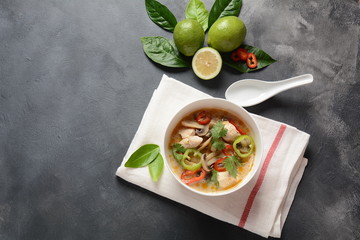 Thai style coconut milk soup-Tom Kha Gai with chicken,mushrooms, galangal, lime leaves, lemongrass, chili peppers. Thai cuisine food concept