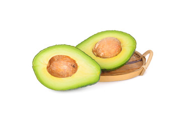whole and sliced Pinkerton avocado on white background