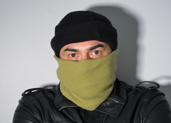 portrait of young man in hood and mask