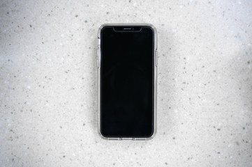 iphone cellphone on white marble table