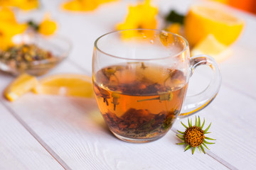 Herbal natural hot tea with different herbs,lemon and honey. Vitamins, healthy lifestyle concept