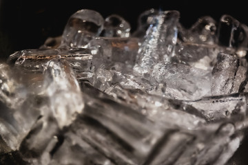 close up ice cubes on the black background