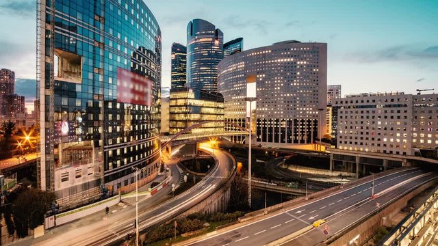 Loop Time lapse video of Paris overlooking the light trails of passing cars in the La Defense business district.