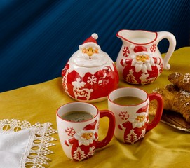 Santa Claus Christmas coffee and tea set on festive table