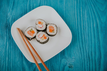Fototapeta na wymiar Appetizing tasty Japan rolls on a plate