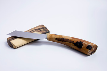 Artificial Thai knives Placed on a knife made of old wood white background