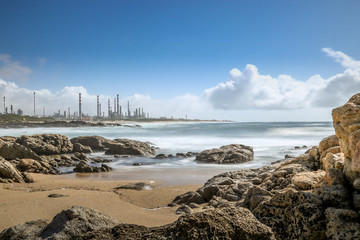 Landscape of Leça da Palmeira beach in Matosinhos, Porto. With the refinery in the background.