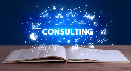 CONSULTING inscription coming out from an open book, business concept