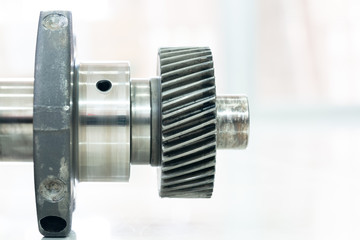 crankshaft of the diesel engine on a white background. flange of fastening of a flywheel to the...
