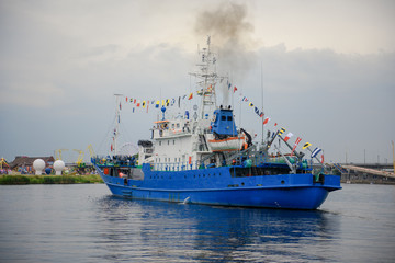 Fototapeta premium Transport vessels depart from the port to the open Baltic Sea