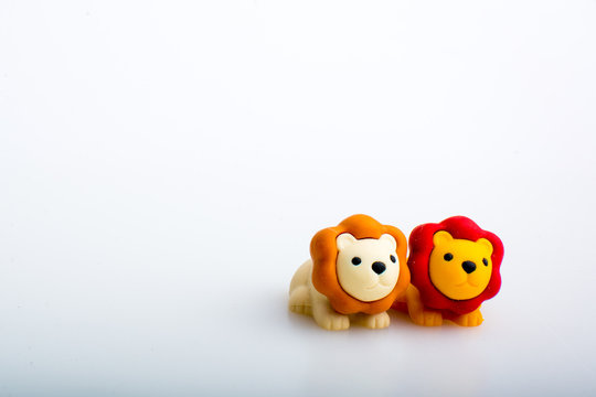 Two lion rubber toys, cute animal shaped rubber doll isolated in white background. 