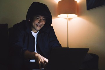 Hacker man using laptop.