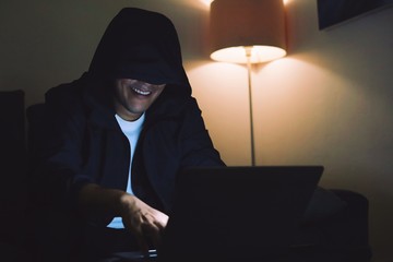 Hacker man with laptop