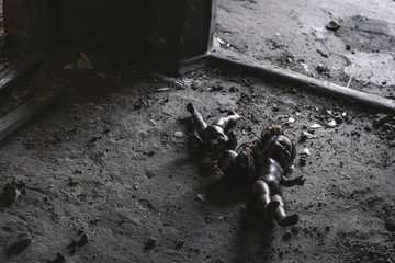 abandoned and scary baby dolls on ground, post apocalyptic concept