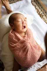 asian women mother mom looking at newborn infant with love