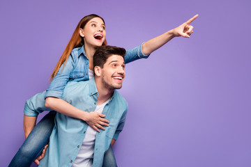 Portrait of enthusiastic two students couple of sweethearts have date point index finger at...