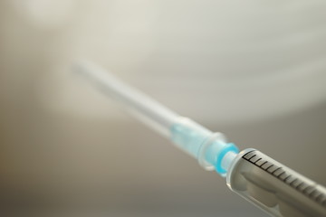new syringe in case, side view, selective focus.