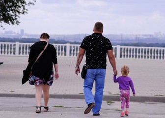 Fototapeta premium family walking on beach