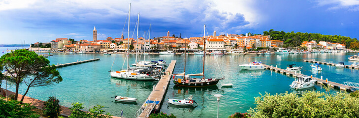 Fototapeta na wymiar Travel in Croatia- beautiful island Rab. Panoramic view of marine and old town