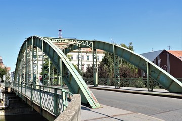 Large bridge over the river with a metal arch construction.