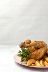Appetizing roast chicken with garlic potatoes and onions