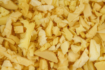 yellow polyurethane foam rubber pieces background texture. stuffing for pillows and furniture