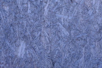 Background. Natural wooden pressed shavings. Chipboard sheet close up, the background is empty