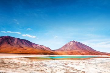 Licancabur volcano and Laguna Verde (Green lagoon) on plateau Altiplano, Bolivia. South America...
