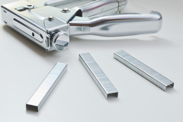 industrial stapler with staples.on white background