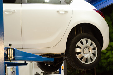 white color car service hydraulic ramp lift car,back view back view