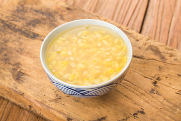 Green bean soup on table wood background