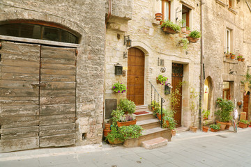 Fototapeta na wymiar Italian old city. Typical medieval Italian street in the heart of Italy.