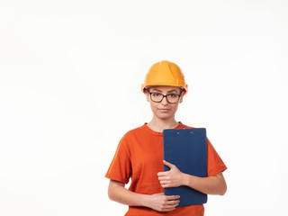 beautiful foreman girl in a yellow helmet with a blue folder on a white background