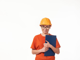 beautiful foreman girl in a yellow helmet with a blue folder on a white background