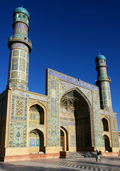 Fototapeta premium Herat in western Afghanistan. The Great Mosque of Herat (Friday Mosque or Jama Masjid). The mosque is decorated with mosaics and Quranic calligraphy. Friday Mosque with people in Herat, Afghanistan.