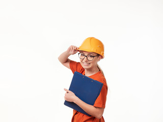 beautiful foreman girl in a yellow helmet with a blue folder on a white background