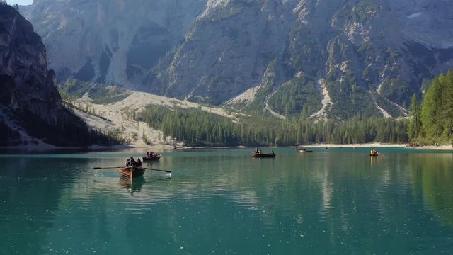 Boats Boat on the Mountain Lake Aerial 4K In Dolomites Lago di Braies.Italy Dolomites 4k Footage Drone Shot in UHD 4K