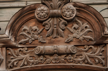 Vintage carved wooden decoration frequently used on windows in urban buildings.