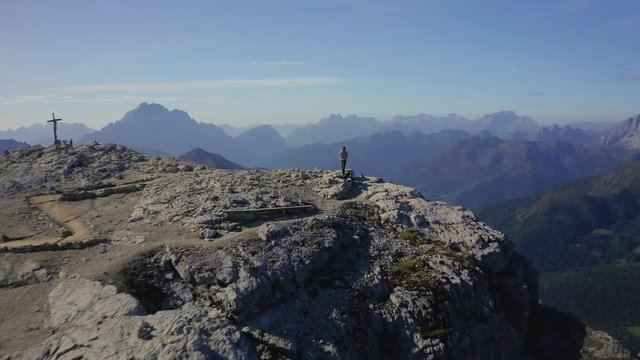 Man Alone on Top of the Mountain Ridge Aerial Drone 4K View.Italy Dolomites 4k Footage Drone Shot in UHD 4K