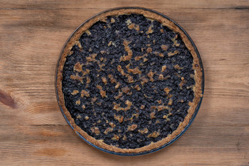 Homemade organic blueberry pie dessert ready to eat, close up. Blueberry tart with walnut. Close up