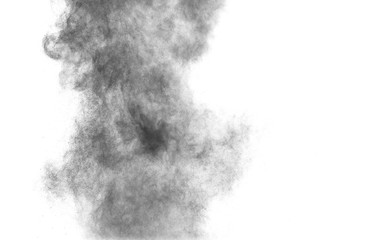 Black powder explosion against white background.Charcoal dust particles cloud in the air.