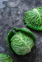 Fresh savoy cabbage on a dark background. the view from the top. Copy space