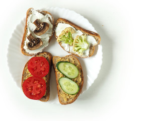 Sandwiches with vegetables and fruits on white . Vegan. Healthy diet. Copy space.